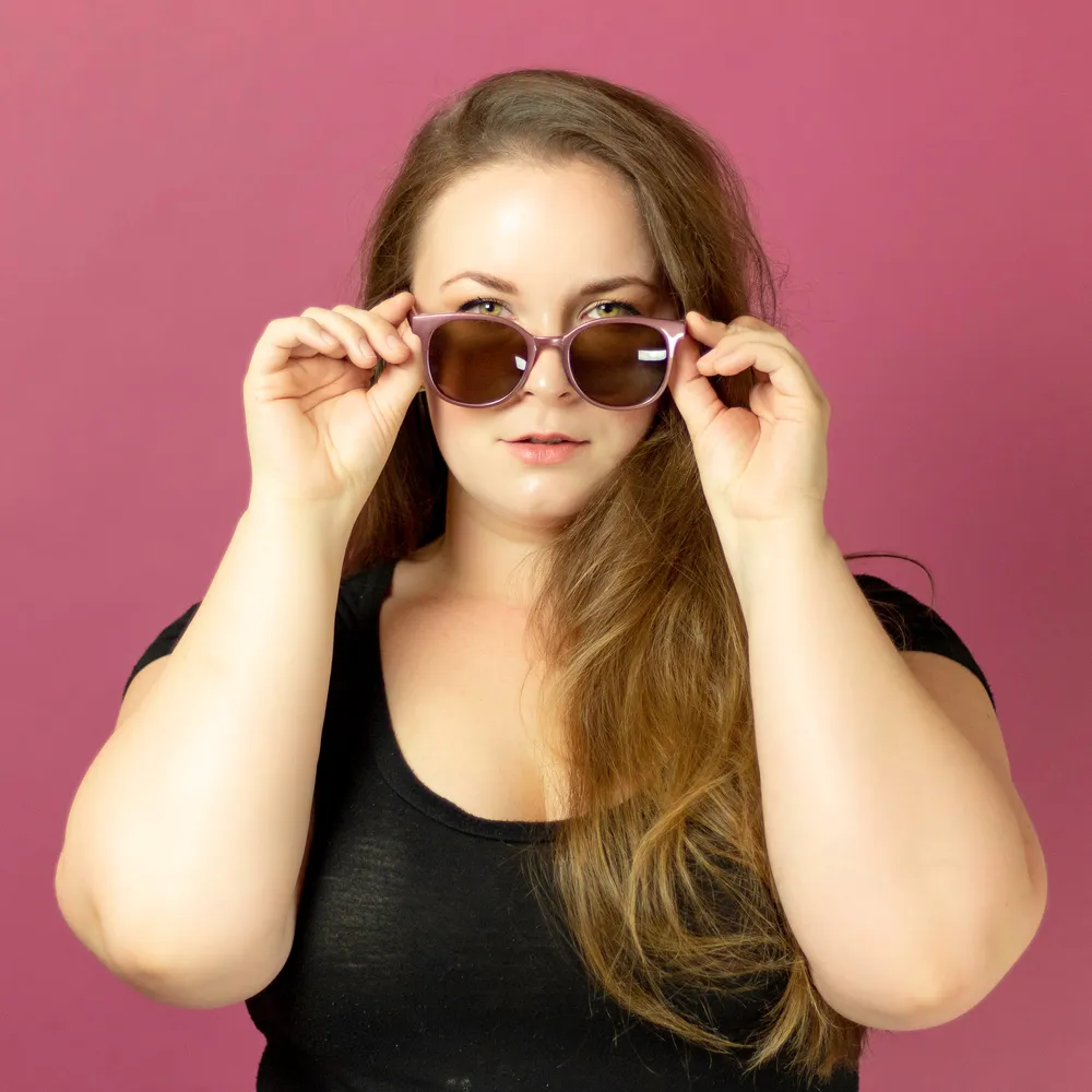 Mandy Brooke in a black shirt with sunglasses.